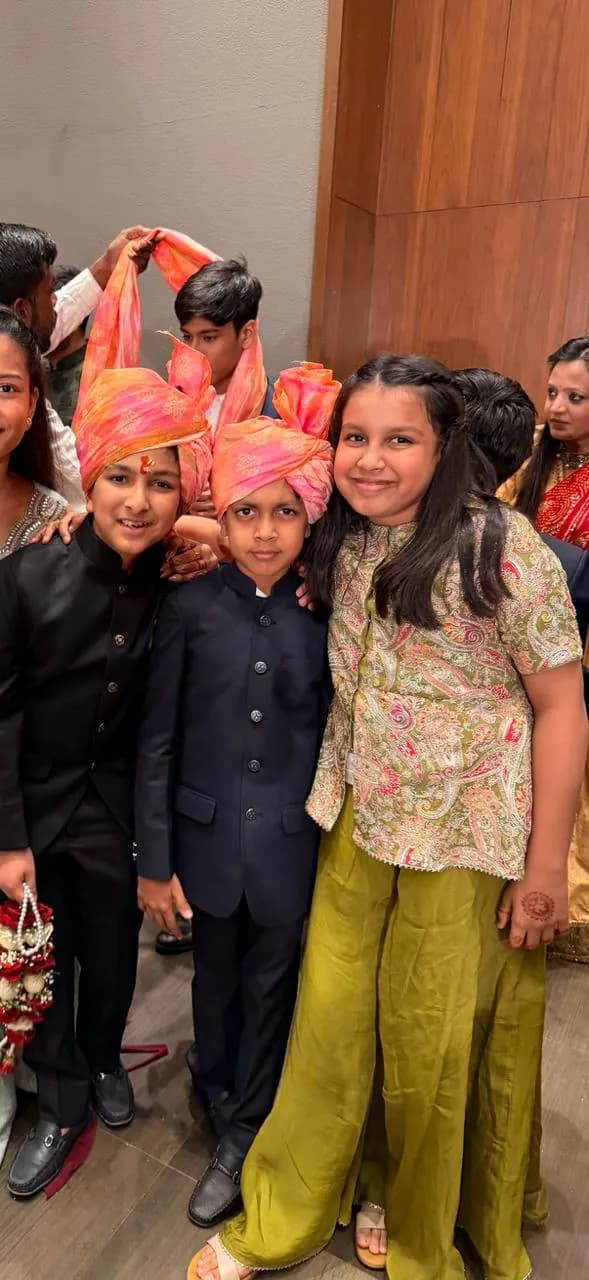 Children in festive outfits at a wedding celebration